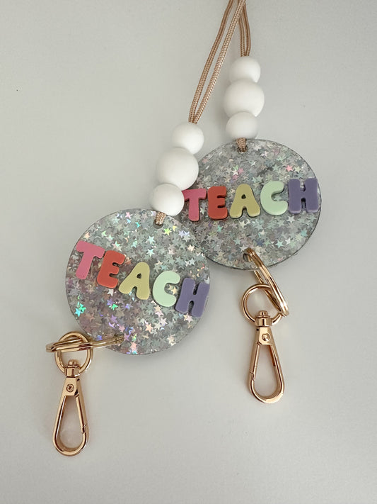 silver glitter star + pastel multi-color TEACH lanyard