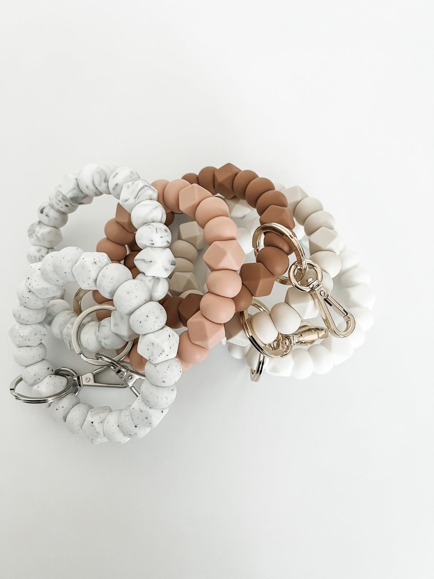 solid tone bracelet keychain in speckled white with small hexagons