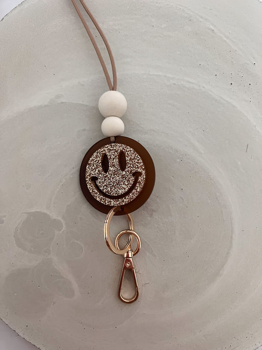 golden glitter and frosted amber (two layer) smiley lanyard