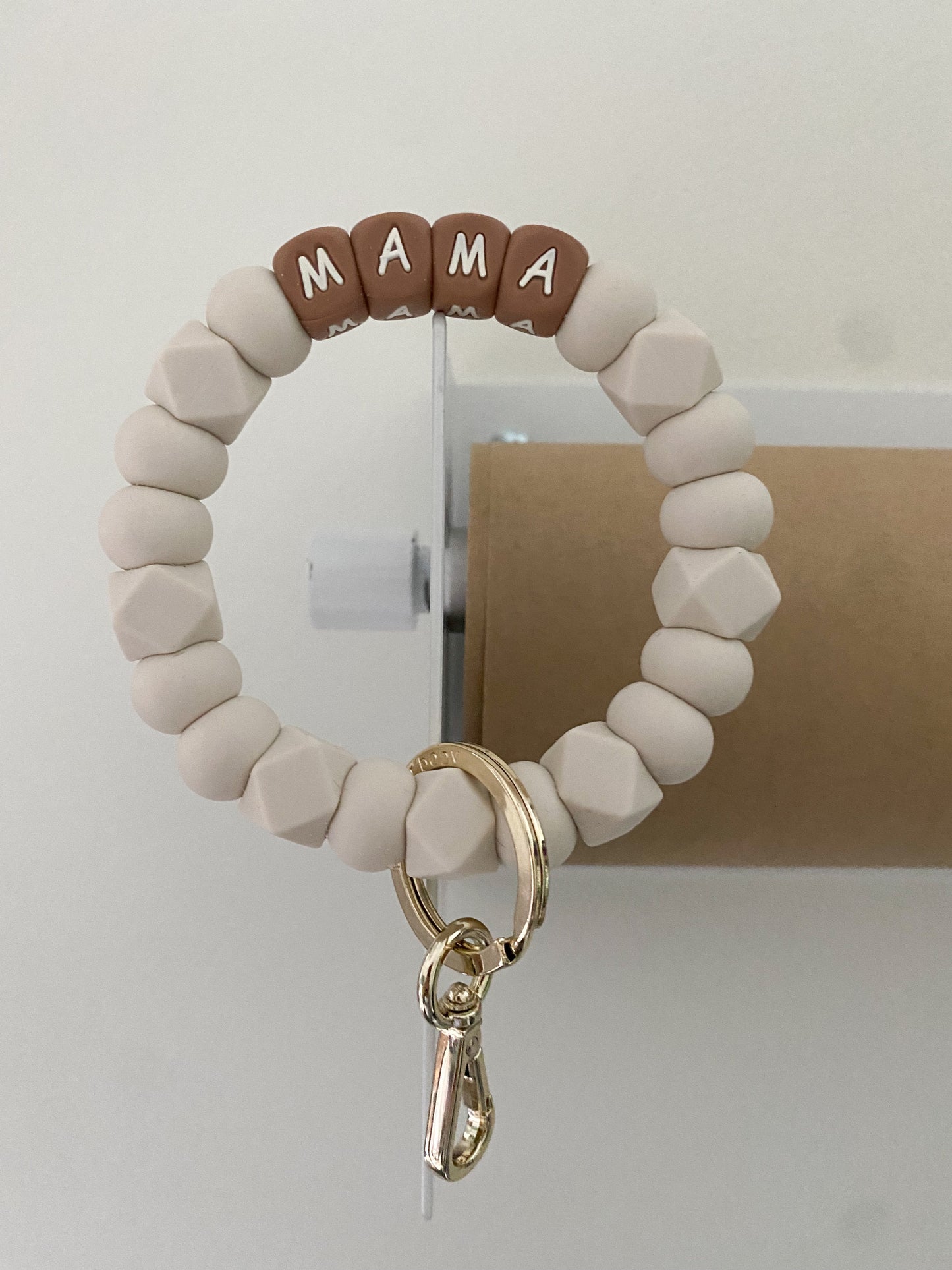 ivory and camel TEACH + MAMA bracelet keychains