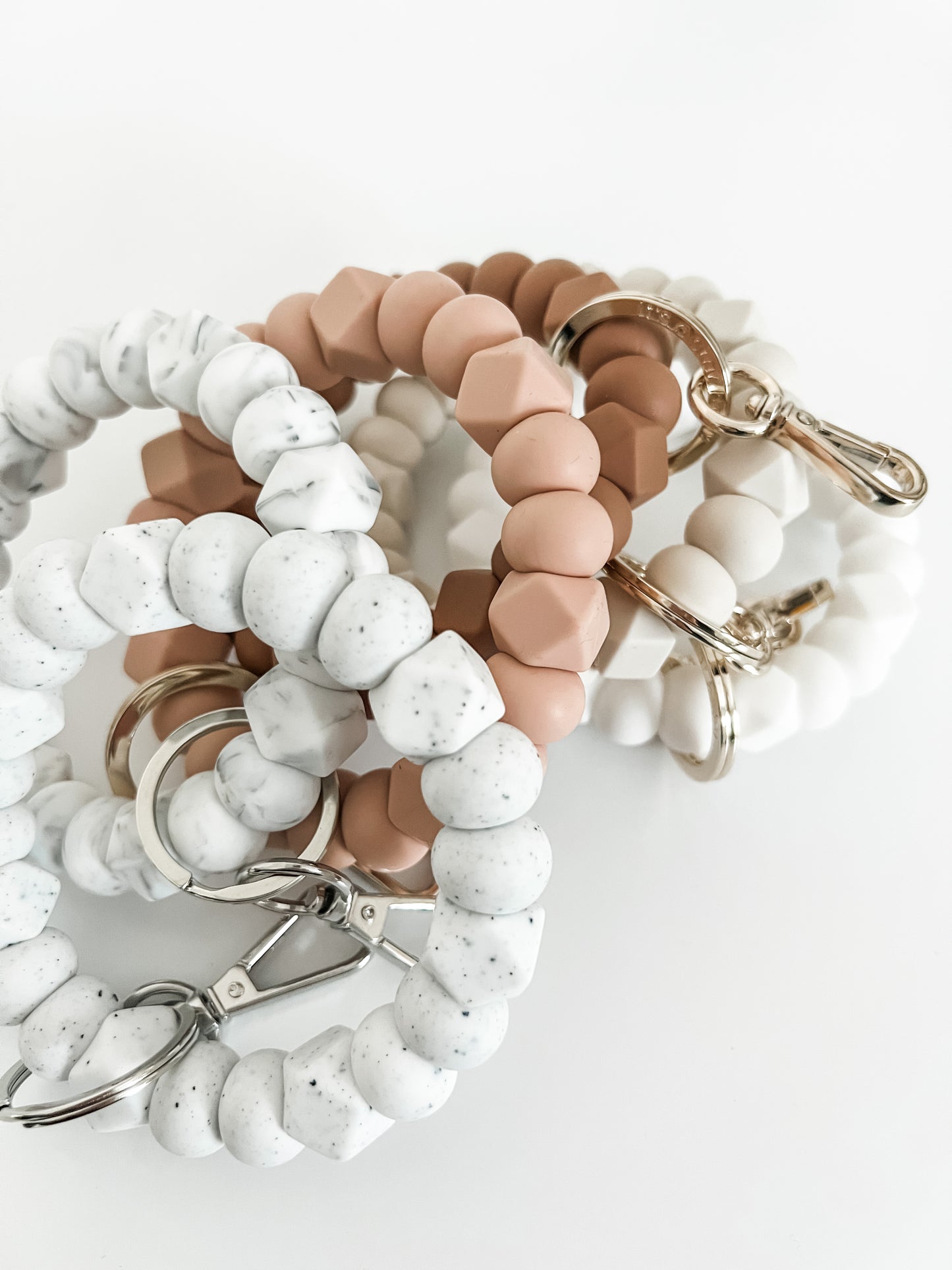 solid tone bracelet keychain in speckled white with small hexagons