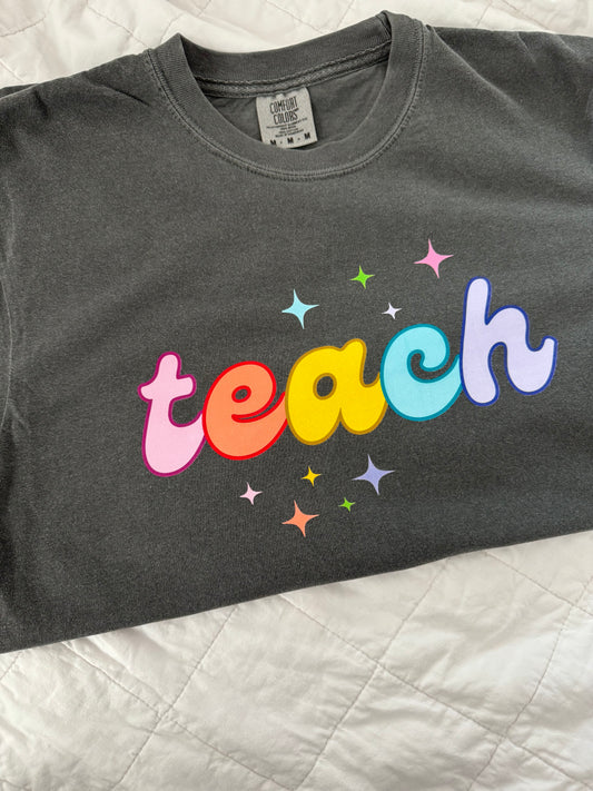 “teach” t-shirt on pepper comfort colors