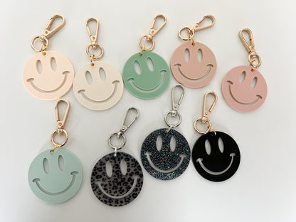 muted smiley charms