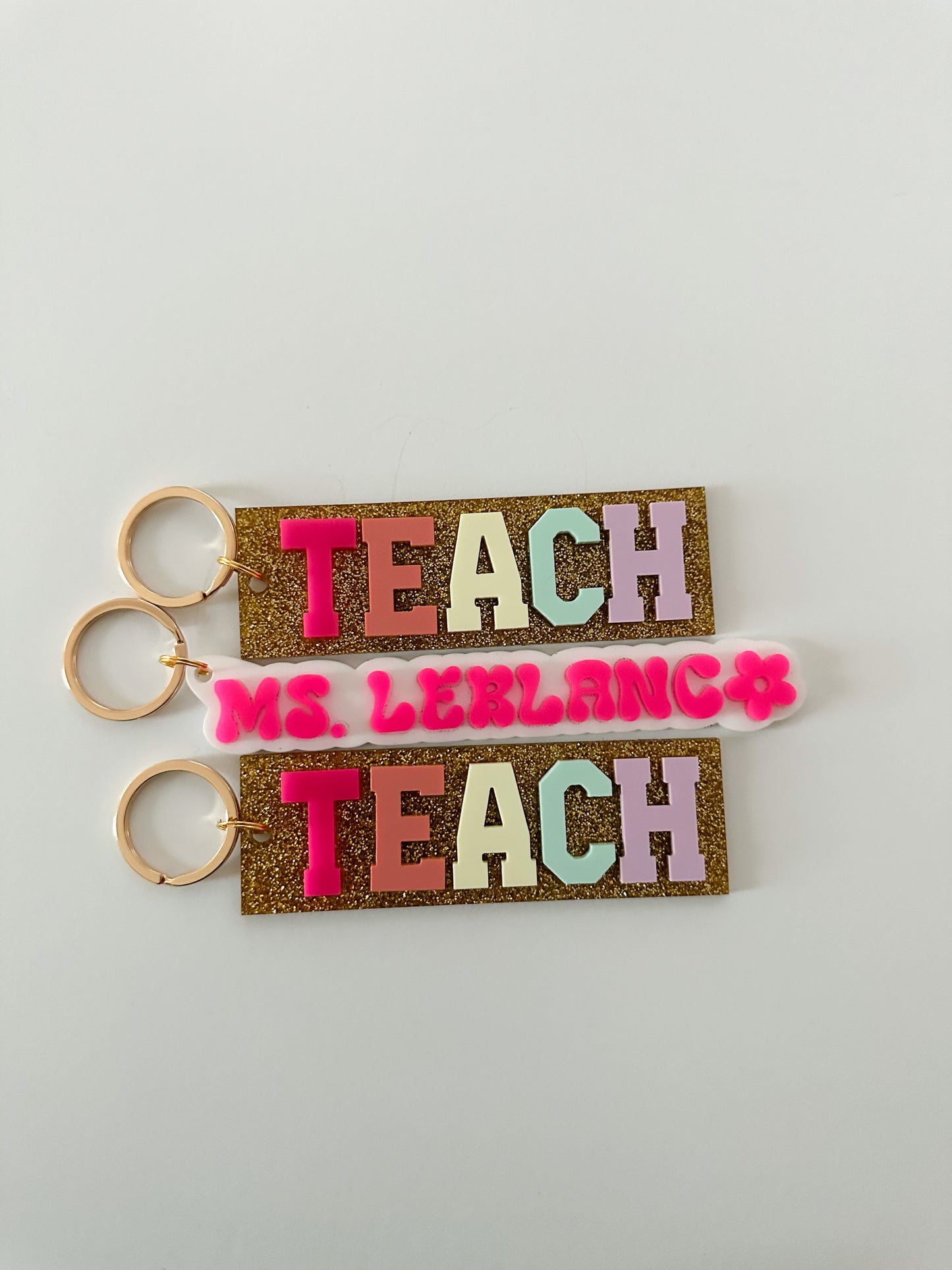 TEACH bag tag / multicolor with gold glitter background