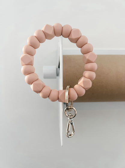 solid tone bracelet keychain in blush with small hexagons
