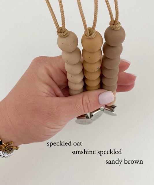 new brown tones // pacifier clips