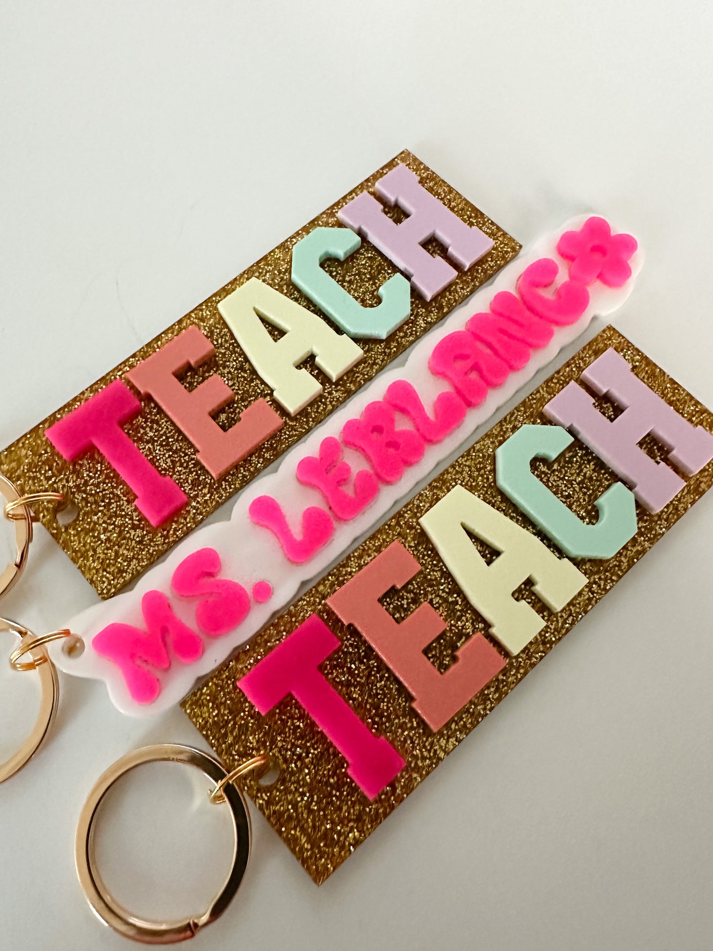 TEACH bag tag / multicolor with gold glitter background