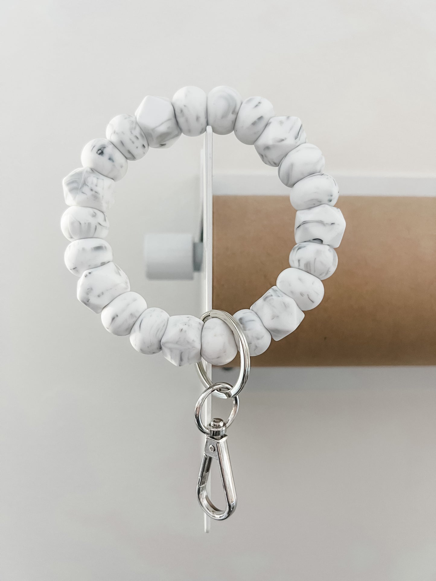 solid tone bracelet keychain in marble white with small hexagons