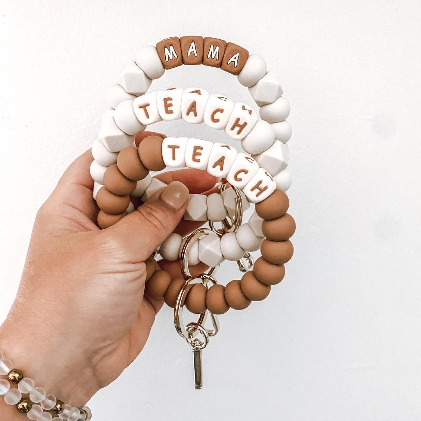 ivory and camel TEACH + MAMA bracelet keychains